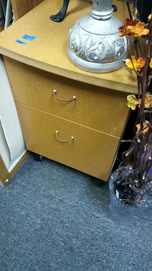 File cabinet wood. On wheels no lock