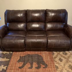Leather Reclining Sofa By Ashley Furniture