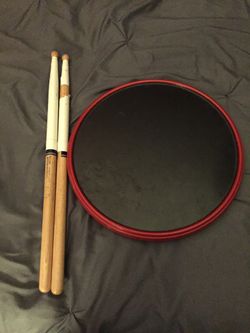 Marching drum pad and sticks