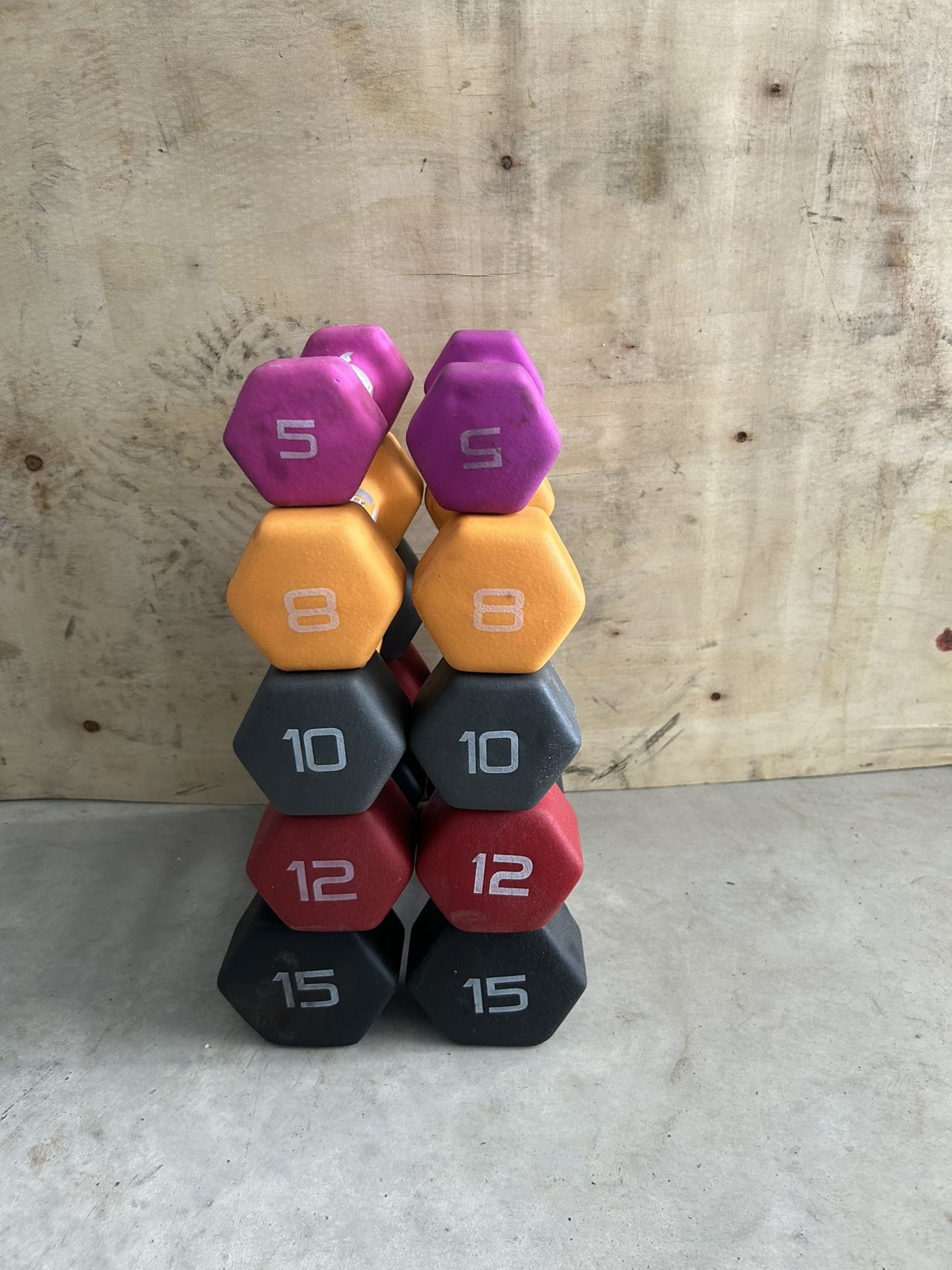 Pair of 5,8,10,12,15lb dumbbells with cuts in the neoprene $75