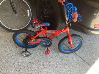 Huffy Spiderman 16” bicycle with training wheels, adjustable seat, Spiderman bling, seat is a little rough but a cute, safe, and fun bike