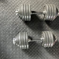 Pair Of 50 Pound Adjustable Dumbbells