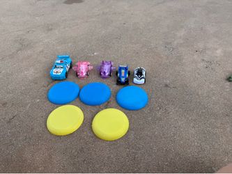 Bundle of five toy cars and five mini frisbees
