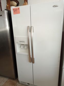 Whirlpool side by side Refrigerator white ex large clean .Warranty . Delivery available . 2203 Fowler st. Ft. Myers 33901