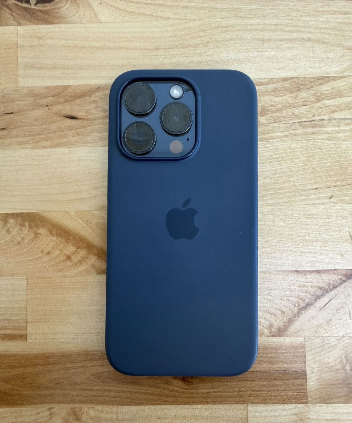 Unlocked iPhone 15 Pro 128GB Blue - Cracked back works like new.