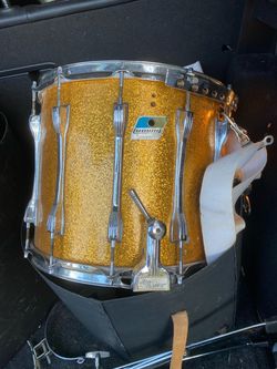 Two Ludwig gold sparkle marching drums