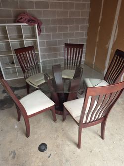 Glass table  (sterdy and strong) with 5 chairs