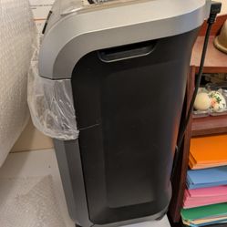 Paper Shredder.  Fellowes Brand.  Please Excuse The Dust! 