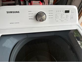 White Samsung washer, and dryer side-by-side