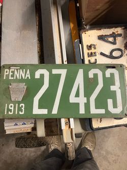 Porcelain license plate with badge