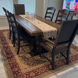Wooden dining table with 8 chairs