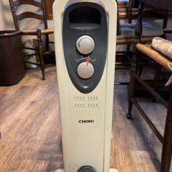 Heater Oil Filled Radiator    Like New.   Selection Knobs For Hear Control.  On Wheels.  Heard Amazingly Well. New From &60 To $80.