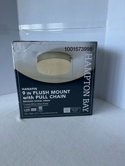 HANA FIN 9-inch flush mount light features a brushed nickel finish and a pull chain for easy operation