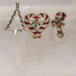 Vintage go toned with the enamel paint, heart, candy, cane, and a candy, cane pens, and a go to Christmas tree with a simulated diamond