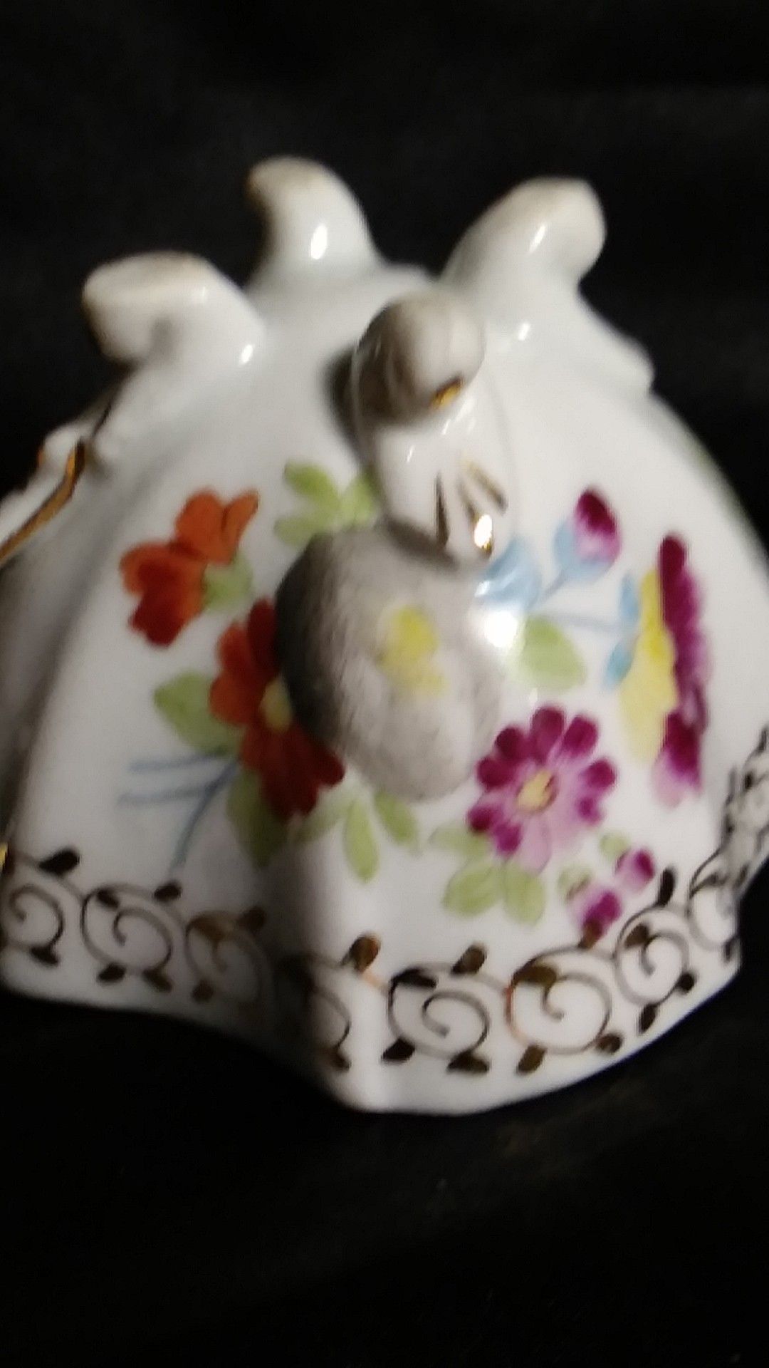Miniature Porcelain Tea Cup. Four Footed Hand Painted Gold Trim