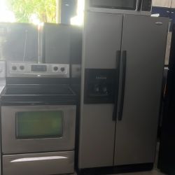 Fingerprint Free Stainless Side-By-Side Refrigerator Stove Microwave