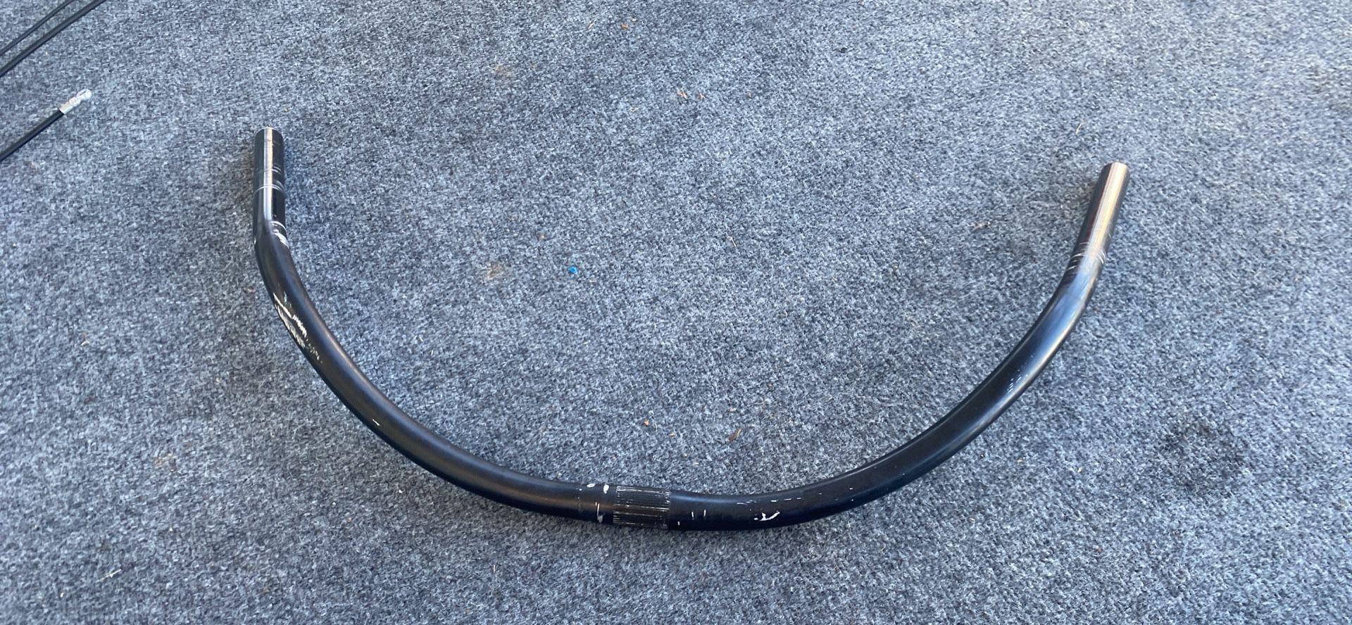 Used black E bike handlebars, curved aluminum bars