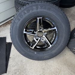 New 205-75-14inch trailer tires with black aluminum wheels.  In stock.