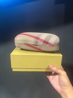This item is a Burberry Nova Check clamshell eyewear case,