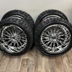 NEW 22x12 mirror chrome fittipaldi wheels wrapped in AMP TERRAIN RT 33x12.50r22 tires