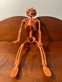 Halloween Orange Hanging Skeleton 13.5” long x 4.5” wide x 2” depth