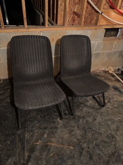 Two wicker woven chairs
