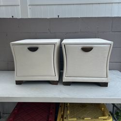 Pair of Matching White Nightstands / End Tables  Selling a matching pair of stylish nightstands with a textured ivory/white finish, curved sides, dark