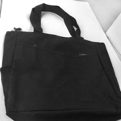 Canvas tote bag with front and side buttons.