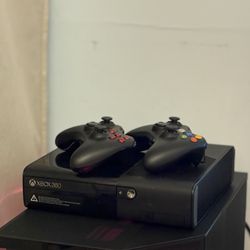 Xbox 360 console with 2 controllers and HDMI cable