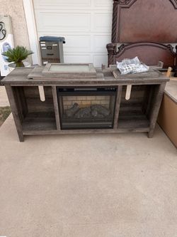 Ashley Furniture - Wynnlow 60" TV Stand with LED Electric Fireplace Insert