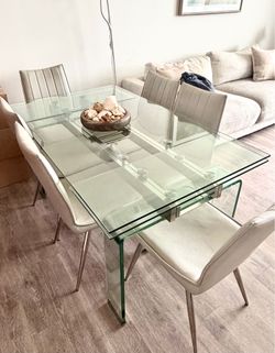 7-Piece Contemporary Glass Dining Table Set, 6 White Faux Leather Chairs.