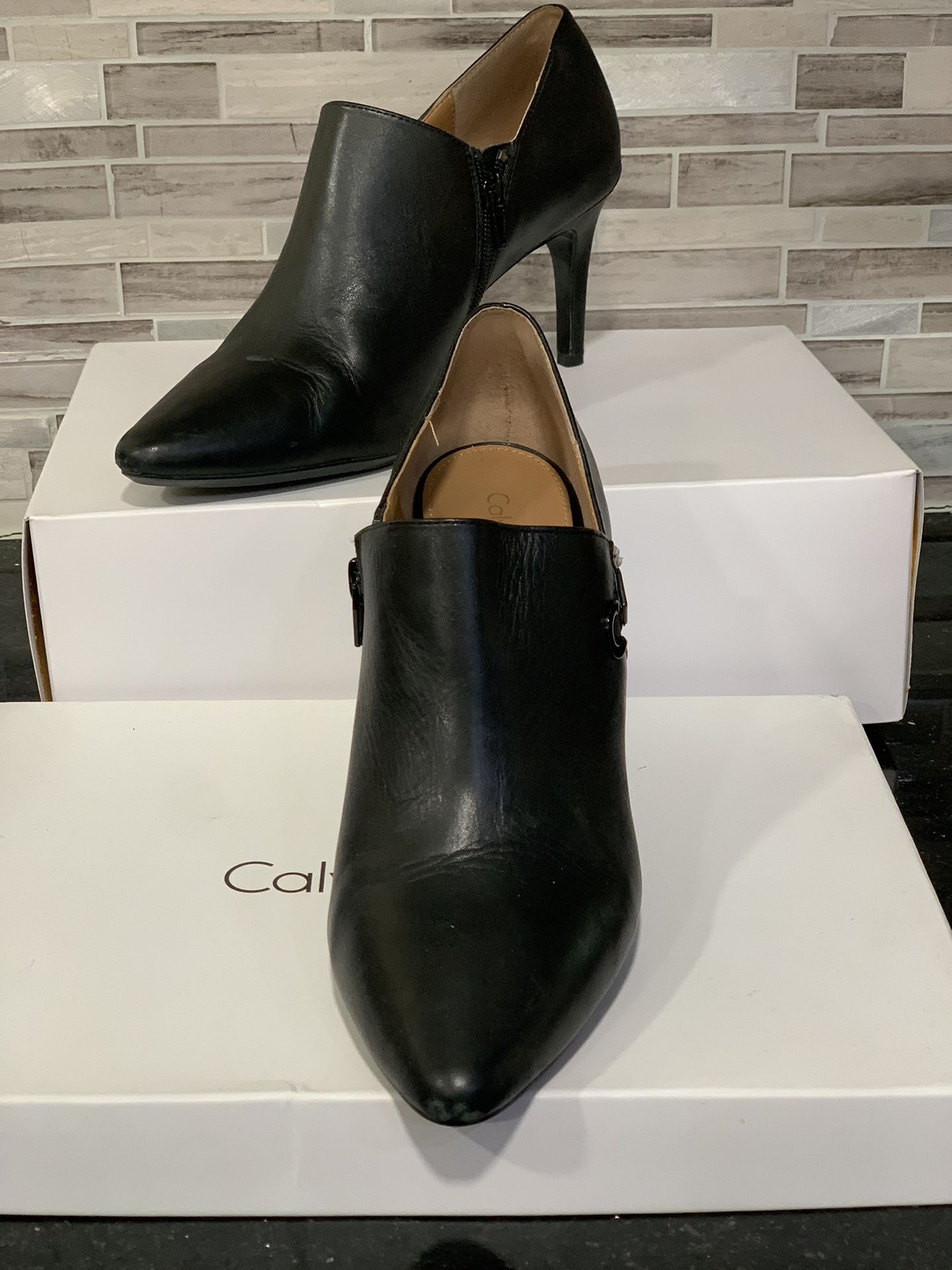 Women's 10M Calvin Klein Joanie Deep Black Cow Silk Ankle Booties