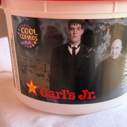Vintage Carl's Jr. "Cool Combos" promotional bucket featuring characters from The Addams Family.
