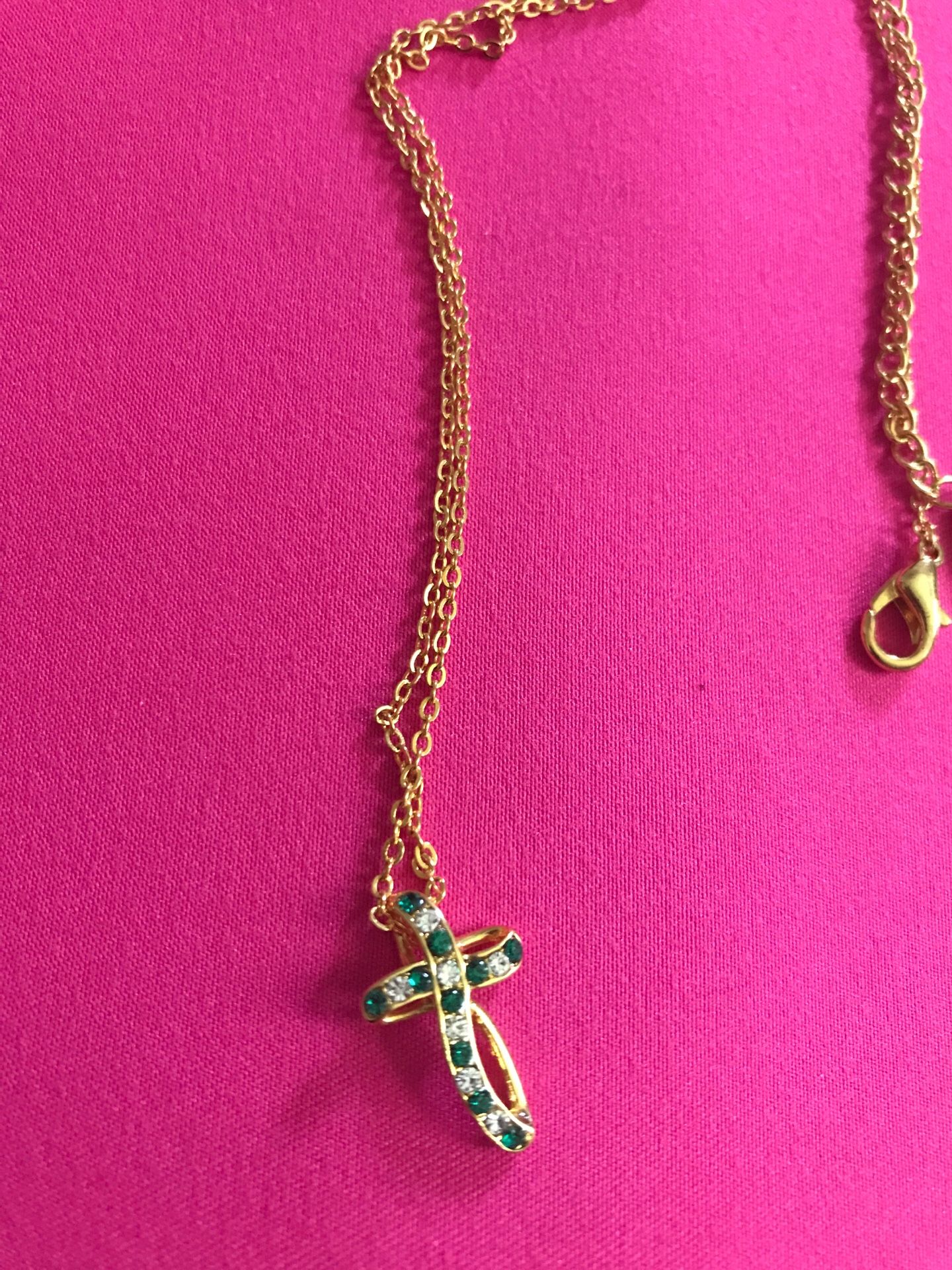 Gold plated cross detail emerald and diamond stones
