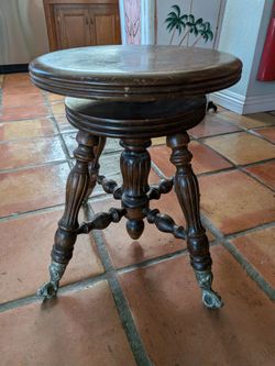 Vintage 1970s Victorian reproduction piano stool with glass ball claw feet. Swivel stool. Piano bench