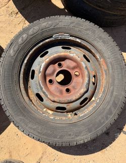 vw early 4 lug stock rim w/tire