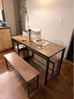 Dining table with pullout stools