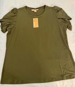 This is an olive green Michael Kors short-sleeve crewneck top featuring gathered puff shoulders. Size LARGE