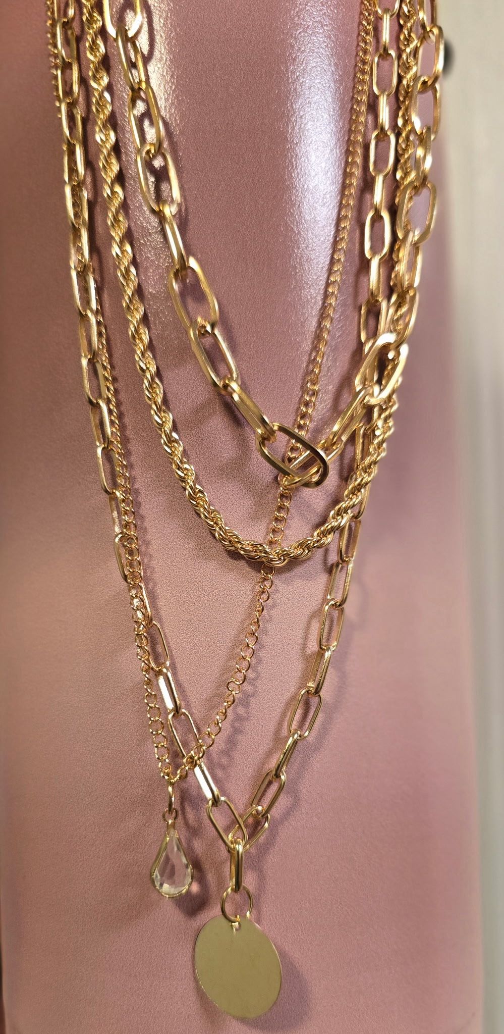 4 chain layered gold-tone chain with a crystal and disc pendant