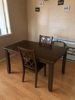 Dining room table with two chairs