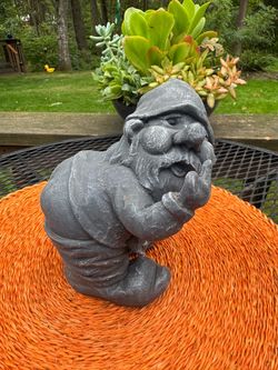 Funny concrete garden gnome