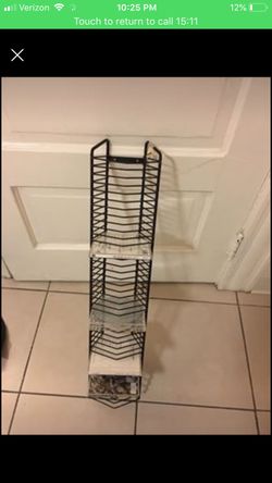 Does not fit DVD’s. This is for the typical jewel case for music CD’s. This rack holds about 40 cds.
