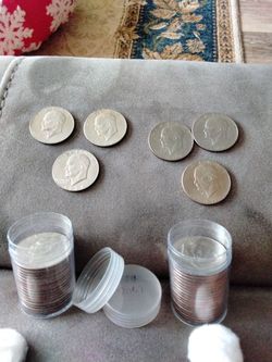 37  eisenhower dollar coins by center , one uncircadiated Ike dollars collection