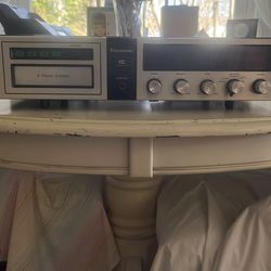 Panasonic, AM/FM radio,  8 tack tape player .