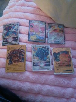 A couple of rare Pokemon cards and a couple of not so rare cards