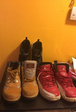 3 pair of tennis shoes timberland,red Jordan black sport