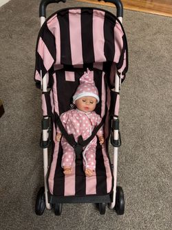 Toy stroller with a doll for little mamas