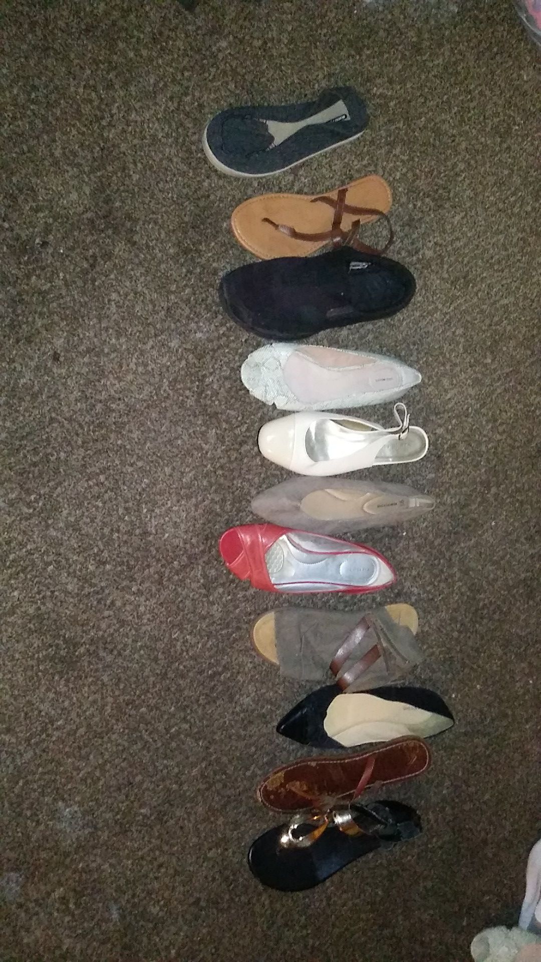 Assorted women's shoes also some clothes brand new golf clothes with price tag on them