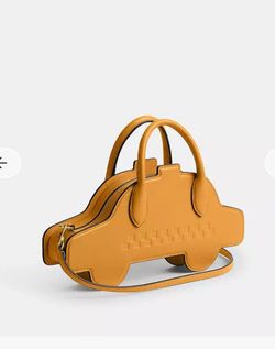 NWT Coach Yellow Taxi Cab Bag & Style Number CY835 Measurements Length: 12.0" Height: 6.25" Width: 2.0" Materials Glovetanned leather Leather lining
