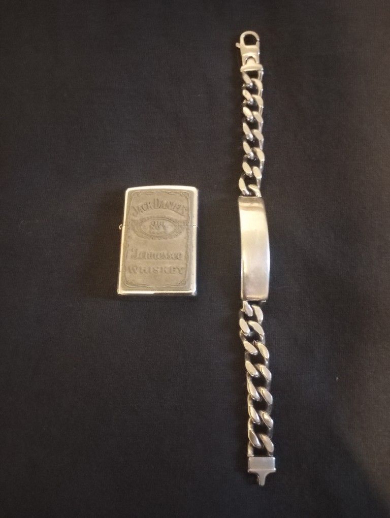 Jack Daniels Zippo Lighter and a Men's Silver Bracelet...$50
